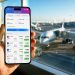Toutes les applications qui m'ont permis d'économiser en voyage (Le guide complet 2026) 3 Smartphone affichant une application de comparaison de vols pas chers dans un terminal d'aéroport avec des avions en arrière-plan.