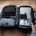 Ce que j'ai vraiment mis dans mon bagage cabine après 15 voyages (Ma liste complète 2026) 6 Un sac à dos de voyage ouvert à plat dévoilant une organisation optimisée avec des cubes de rangement et des accessoires de voyage.